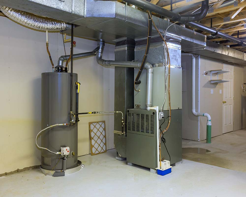 Basement with a water heater and HVAC system