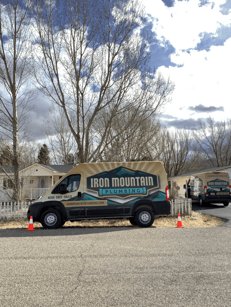 Iron Plumbing truck outside after water softener installation Cedar City