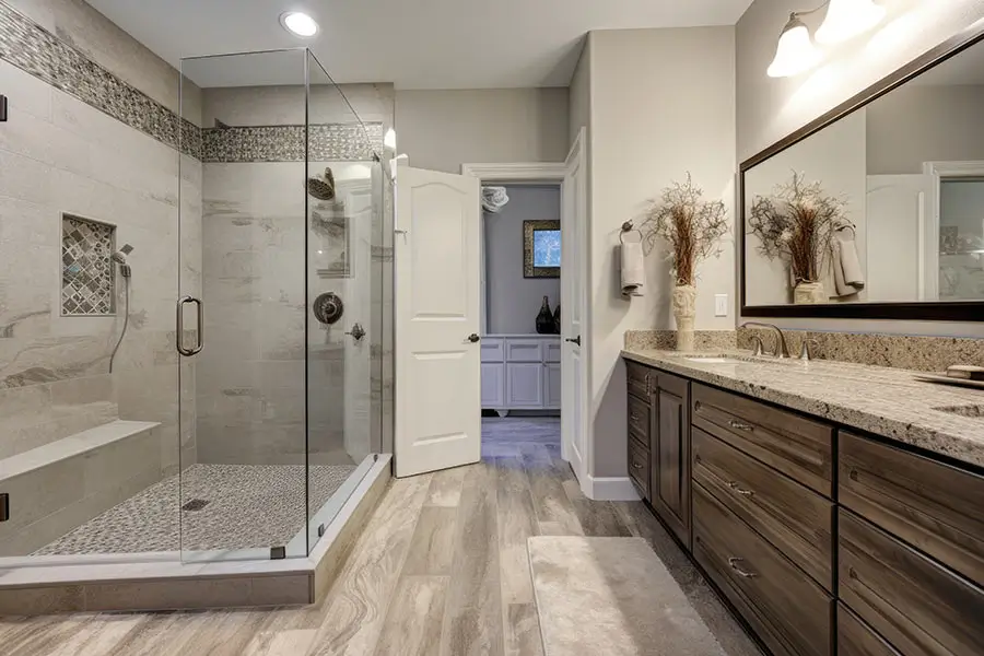 Modern bathroom with glass shower and wooden vanity