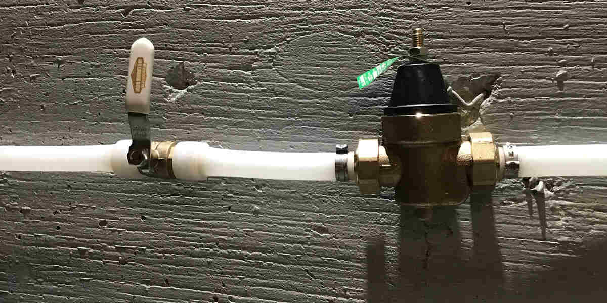 Water pressure regulator installed on a pipe
