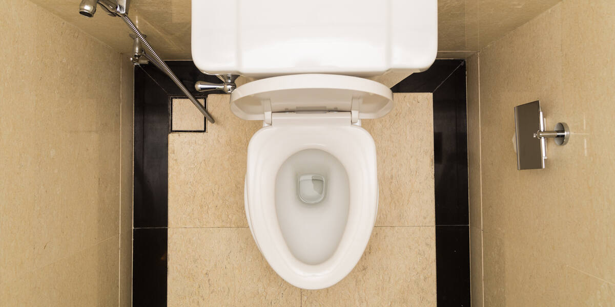Top view of a clean toilet with an open lid