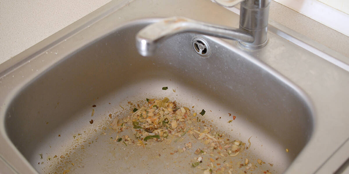 what causes kitchen sink to clog